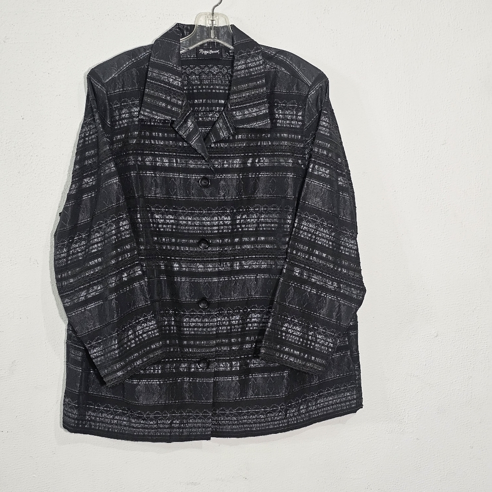 Maggy London The cut of the jacket, with buttons on the right (common in women's
